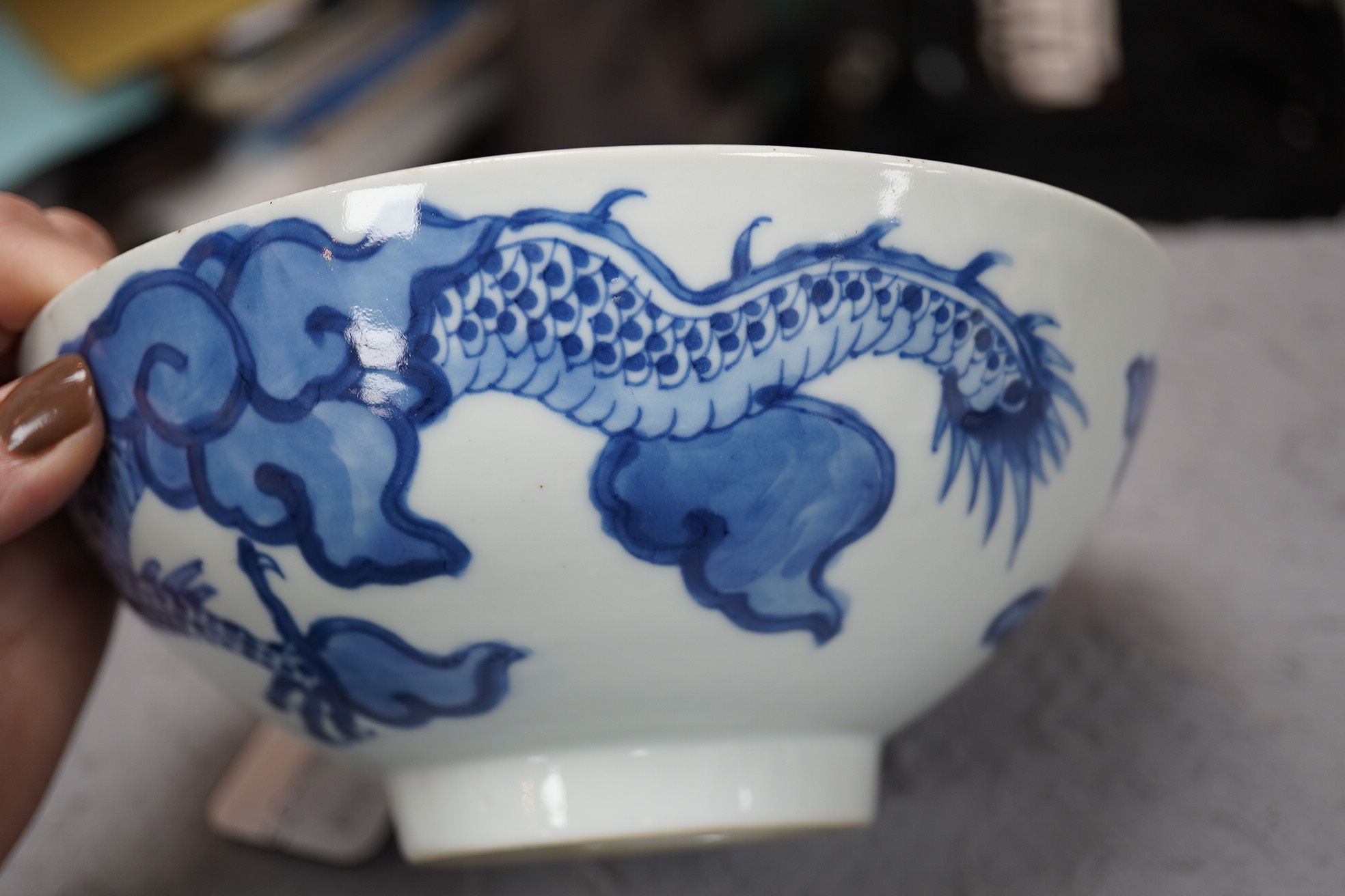 A Chinese blue and white ‘cloud and dragon’ bowl, Yongzheng mark and period (1723-35)